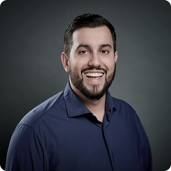 Marcello Genovese smiling during client meeting in office