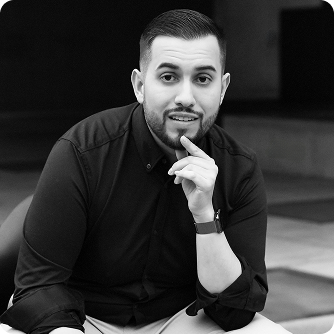 Marcello Genovese in advisory meeting holding folder with client